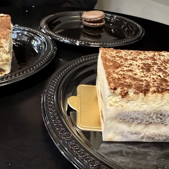European Taste - Tiramisu cake and a chocolate macaron. - Coffee & Tea Near Me - West Des Moines, Iowa European Taste - Tiramisu cake and a chocolate macaron. - Coffee & Tea Near Me - West Des Moines, Iowa
