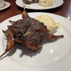 Santa Fe Steakhouse - Grilled quail with garlic mashed potatoes