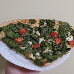 Big Brothers Gourmet Pizza - Spinach, tomatoes, garlic, and feta pizza slices