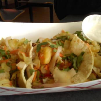 Neptune's Net - pineapple fish tacos.  Well I could see the pineapple but couldn't taste it.  Fish tacos were average at best - Seafood Near Me - Malibu, California