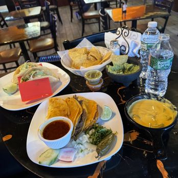 Passion Steak Tacos - a table with a variety of food - Food Trucks Near Me - Lawrence, Massachusetts