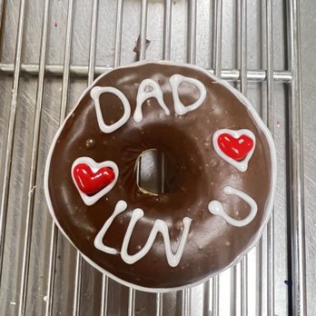 Fresh & Creamy Donuts - a chocolate donut with white icing and red hearts - Donuts Near Me - Lewisville, Texas Fresh & Creamy Donuts - a chocolate donut with white icing and red hearts - Donuts Near Me - Lewisville, Texas