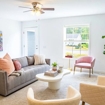 Hangar Flats - A living room with white walls and a gray couch - Apartments Near Me - Batavia, Ohio Hangar Flats - A living room with white walls and a gray couch - Apartments Near Me - Batavia, Ohio