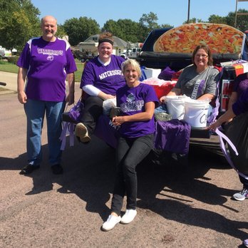 Casey's - a group of people in purple shirts posing for a picture - Pizza Near Me - Beresford, South Dakota Casey's - a group of people in purple shirts posing for a picture - Pizza Near Me - Beresford, South Dakota