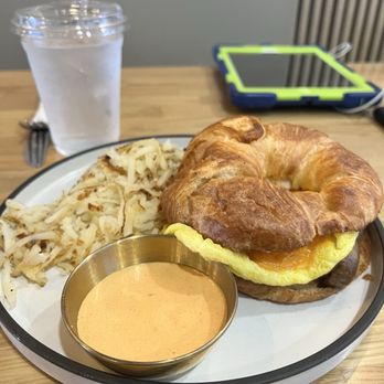 Ahuevo Cafe - Breakfast croissant sandwich with sausage was good. Hash browns were okay. - Mexican Near Me - Tolleson, Arizona