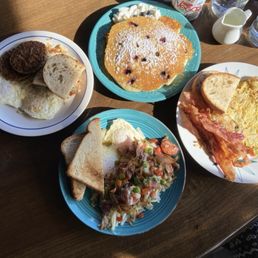 Blueberry pancakes, Farmers Harvest Omelette w bacon and toast, eggs, sausage a toast and kielbasa hash with over easy eggs