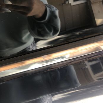 Shell - a man taking a selfie in front of a mirror - Gas Stations Near Me - Northridge, California