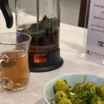 Rumaan Mediterranean Cuisine - Tea in a french press with marinated olives. The good life! - Mediterranean Near Me - Cedar Park, Texas Rumaan Mediterranean Cuisine - Tea in a french press with marinated olives. The good life! - Mediterranean Near Me - Cedar Park, Texas