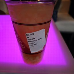 a plastic cup with a drink in it