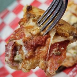 Porta Bella Pizza - A fork with a piece of pizza.