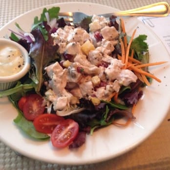 Coco - One of today's specials: Chicken salad with mango, pomegranate and walnuts over greens.  Perfect lunch! - French Near Me - Buffalo, New York