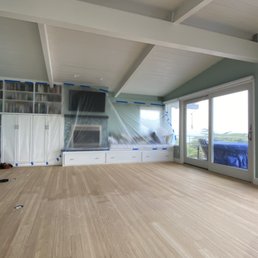 a living room with a view of the ocean a living room with a view of the ocean