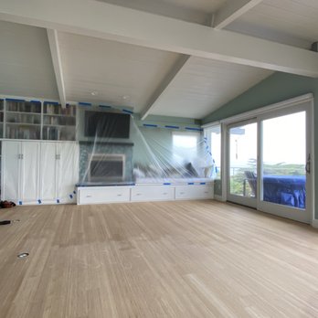 Model Hardwood Floors - a living room with a view of the ocean - Flooring Near Me Model Hardwood Floors - a living room with a view of the ocean - Flooring Near Me