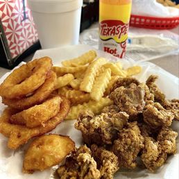 Gizzards, onion rings, fries and small drink. Gizzards, onion rings, fries and small drink.