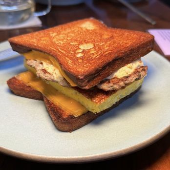True Laurel - TL GRILLED CHEESE AND OMELETTE SANDWICH 2.0 Ginger + Sage Sausage Patty, Fluffy Omelette, Melty Cheese, Giardiniera on Toasted Pain de Mie - Cocktail Bars Near Me - San Francisco, California True Laurel - TL GRILLED CHEESE AND OMELETTE SANDWICH 2.0 Ginger + Sage Sausage Patty, Fluffy Omelette, Melty Cheese, Giardiniera on Toasted Pain de Mie - Cocktail Bars Near Me - San Francisco, California