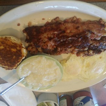 Christo's Cafe - Corned beef hash with two eggs, grits, and buiscuit. - Breakfast & Brunch Near Me - Orlando, Florida Christo's Cafe - Corned beef hash with two eggs, grits, and buiscuit. - Breakfast & Brunch Near Me - Orlando, Florida