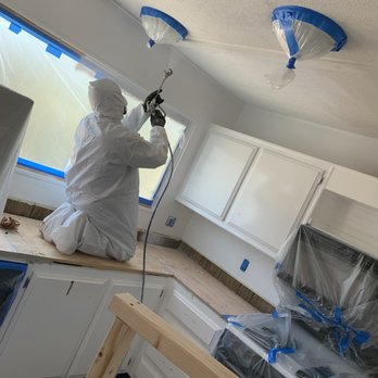 Var-City Contracting - a man painting a kitchen - General Contractors Near Me Var-City Contracting - a man painting a kitchen - General Contractors Near Me