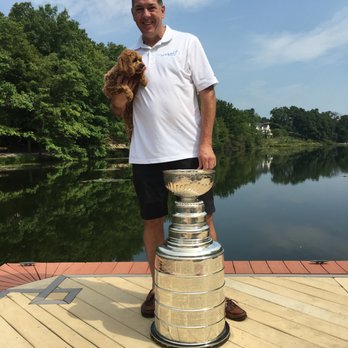 MaidPro - Pittsburgh - Owner Mike McGowan of MaidPro Pittsburgh with Mascot Heidi stand beside the Stanley Cup won by the 2015-16 Pittsburgh Penguins. - Home Cleaning Near Me - Wexford, Pennsylvania MaidPro - Pittsburgh - Owner Mike McGowan of MaidPro Pittsburgh with Mascot Heidi stand beside the Stanley Cup won by the 2015-16 Pittsburgh Penguins. - Home Cleaning Near Me - Wexford, Pennsylvania