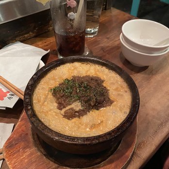 Kingyo - Kobe Beef Uni Cream Udon - soy balsamic kobe beef sauce with sea urchin cream sauce served in a sizzling stone bowl. - Japanese Near Me - Vancouver, British Columbia