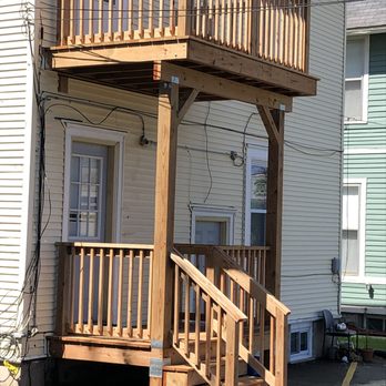 MV Builders - a wooden porch with stairs and railings - General Contractors Near Me - Woodbury, Minnesota MV Builders - a wooden porch with stairs and railings - General Contractors Near Me - Woodbury, Minnesota