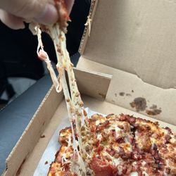 Amie's Pizza Factory - The cheese is very stretchy for you cheese lovers