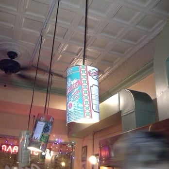 Grano Pasta Bar - Recycled chic: hanging lamps with old olive oil cans for shades at Grano Pasta Bar. - Italian Near Me - Baltimore, Maryland