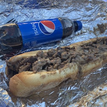Bigfoot Philly Cheesesteaks - Philly cheese. Used a coke bottle to show the size of the sandwich. Sandwich is huge but meat is too thick. - Cheesesteaks Near Me - Sevierville, Tennessee