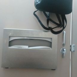 Stalls in the women's restroom have hooks for purses.