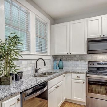 TC Construction - a clean kitchen with stainless steel appliances - General Contractors Near Me TC Construction - a clean kitchen with stainless steel appliances - General Contractors Near Me