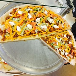 Enzo's Pizzeria - Come in and try one of are many varieties of slices promise u wont be disappointed this here is are taco pizza for all steak lovers