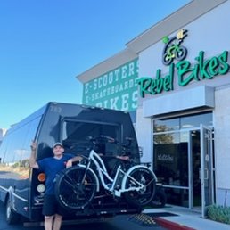 Exterior outside entrance of Rebel Bikes Electric - Another happy customer with 2 cruisers with a rebel bike rack - Murrieta, California Exterior outside entrance of Rebel Bikes Electric - Another happy customer with 2 cruisers with a rebel bike rack - Murrieta, California