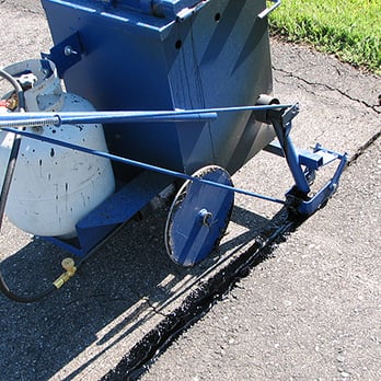Primex Paving - a blue bucket with a white tank on it - General Contractors Near Me - Vaughan, Ontario Primex Paving - a blue bucket with a white tank on it - General Contractors Near Me - Vaughan, Ontario