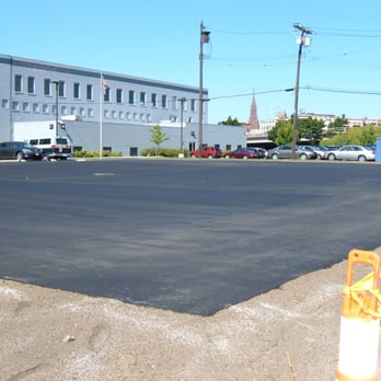 Louis Del Prince & Sons - a parking lot with a yellow fire hydrant - General Contractors Near Me - Buffalo, New York Louis Del Prince & Sons - a parking lot with a yellow fire hydrant - General Contractors Near Me - Buffalo, New York