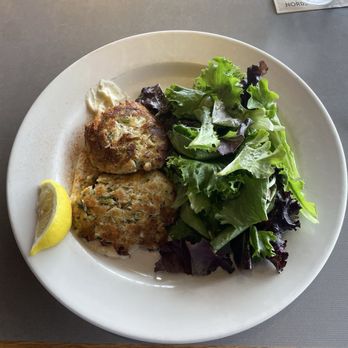Bazille - Crab cakes with mixed greens salad. Remoulade under the cakes. Real good. - New American Near Me - San Diego, California Bazille - Crab cakes with mixed greens salad. Remoulade under the cakes. Real good. - New American Near Me - San Diego, California