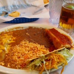 Beef taco, beef enchilada, and pork tamale combo. Beef taco, beef enchilada, and pork tamale combo.