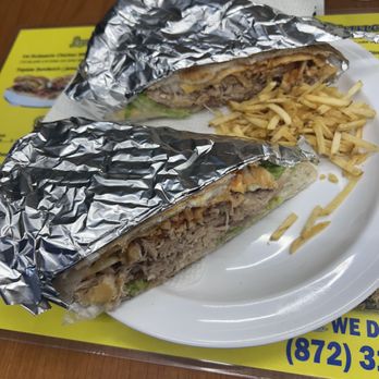 La Cueva Del Indio Cafe - Lechon Sandwich Borinquen style with small fries stick - Puerto Rican Near Me - Chicago, Illinois La Cueva Del Indio Cafe - Lechon Sandwich Borinquen style with small fries stick - Puerto Rican Near Me - Chicago, Illinois