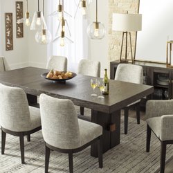 John Paras Furniture & Appliance - Dressed to thrill, this simply stunning dining table offers a high-design look at a down-to-earth price. Ultra sleek lines are accentuated w