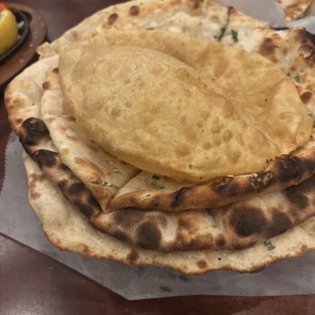 Palace Of Asia - Mix bread basket; Naan, onion kulcha, tandoori roti and puri - Indian Near Me - Maple Shade, New Jersey Palace Of Asia - Mix bread basket; Naan, onion kulcha, tandoori roti and puri - Indian Near Me - Maple Shade, New Jersey