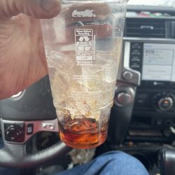 A cup of ice very little soda