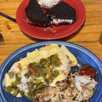 Old Tymer's Cafe - Reuben sandwich and coleslaw on the red plate. Eggs Benedict & hash browns on the blue plate. - Breakfast & Brunch Near Me - Red River, New Mexico