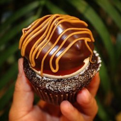 Sister’s Cupcakes - Chocolate cupcake w/ peanut butter buttercream dipped in Ghirardelli chocolate ganache and drizzled with peanut butter.