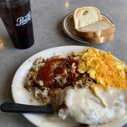 Jim's Family Restaurant - Chicken fried chicken with hash browns with ketchup on them, scrambled eggs with cheese, and white toast.