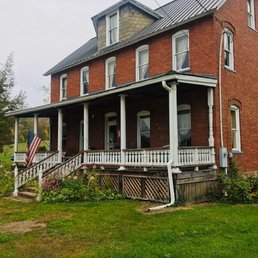 House is located along 2 lane road couple of miles outside of Confluence, PA