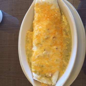 Great Sand Dunes Oasis - Breakfast burrito topped with green chile and cheese. - Hotels Near Me - Mosca, Colorado Great Sand Dunes Oasis - Breakfast burrito topped with green chile and cheese. - Hotels Near Me - Mosca, Colorado