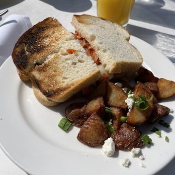 Pacifica Breeze Cafe - Breeze Breakfast Sando (Del Mar Favorite) on sourdough 2/10 Breakfast Potatoes seriously need seasoning 3/10 - Breakfast & Brunch Near Me - Del Mar, California