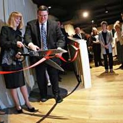 Engle Lane Theatre - Engle Lane Member, Kathy Missel, cuts the ribbon celebrating the opening of the rebuilt theater