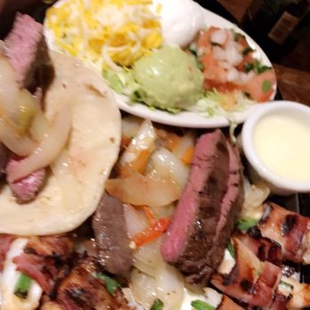 Uncle Julio's - Steak fajitas (the guadalajara with extra bacon wrapped shrimp) plenty for two! - Mexican Near Me - Dallas, Texas Uncle Julio's - Steak fajitas (the guadalajara with extra bacon wrapped shrimp) plenty for two! - Mexican Near Me - Dallas, Texas