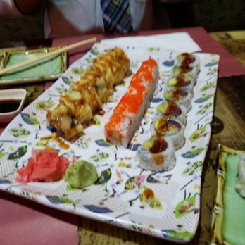 Sushi Cafe - Blurry, but awesome rolls.  Miyazaki, pink lady, and the crunch on the right (the crunch is my favorite) - Sushi Bars Near Me - Tampa, Florida