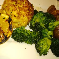 The single crab cake entree with a load baked potato and broccoli