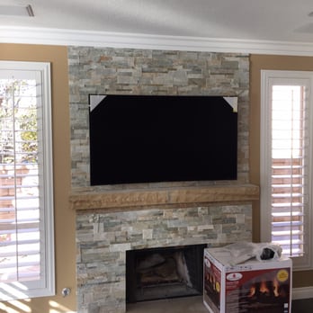 L I Modern Marble - a fireplace with a flat screen tv - General Contractors Near Me - Oxnard, California L I Modern Marble - a fireplace with a flat screen tv - General Contractors Near Me - Oxnard, California